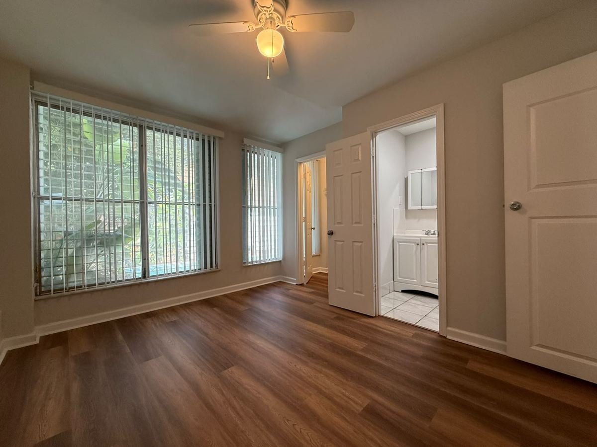 The same room finished with vinyl plank flooring and a fresh coat of paint