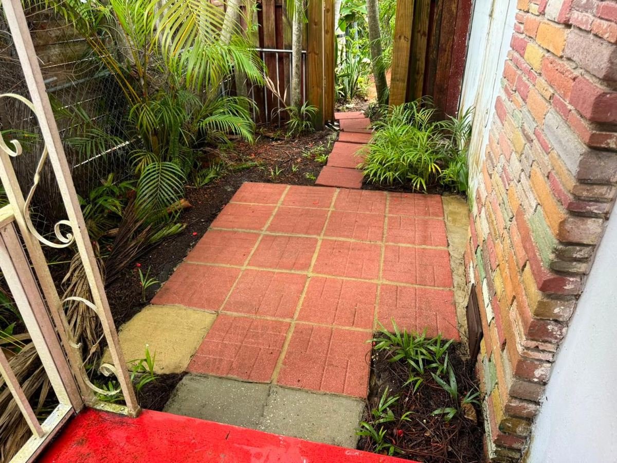 The same walkway clean after pressure washing